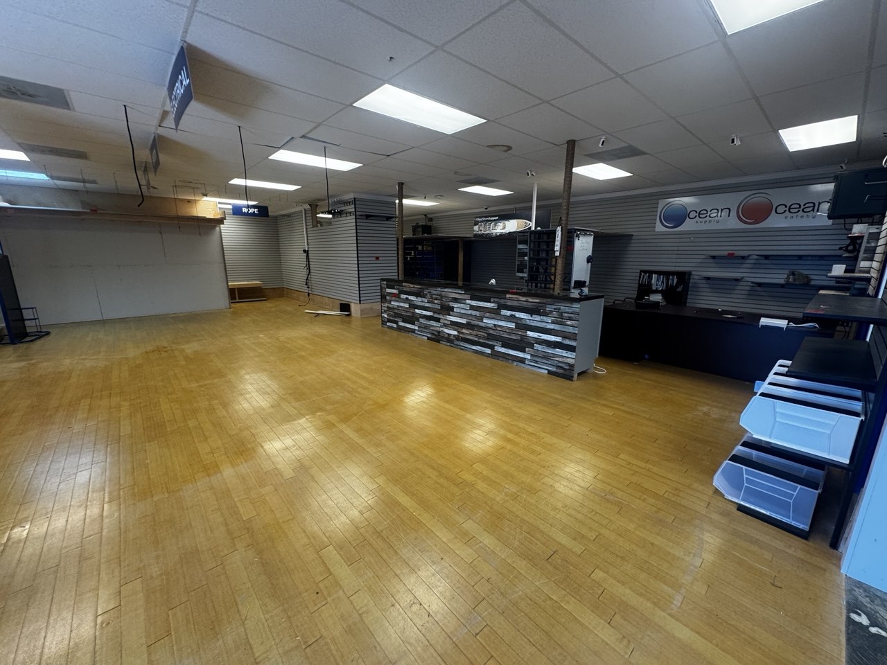 Marine store after liquidation showing cleared open floor